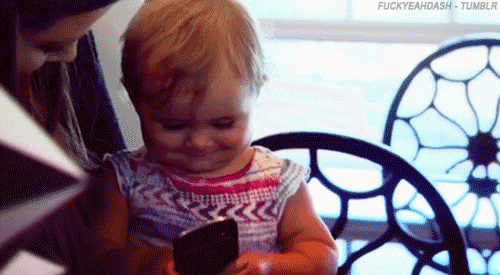 Penelope-Disick-playing-with-a-phone-on-Keeping-Up-With-the-Kardashians-GIF