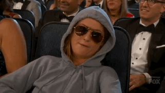 amy-poehler-sunglasses-hoodie-emmys-2015-gif